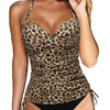 A woman wearing a leopard print crop top and matching high-waisted bottoms.