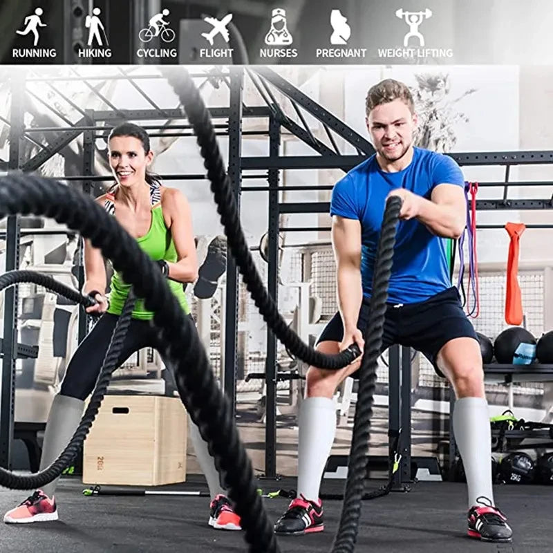 A man and a woman exercising in a gym setting, demonstrating compression socks for vein health.