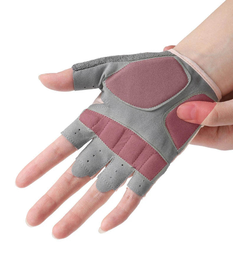 A hand wearing a gray and maroon half-finger sports glove for weight lifting.