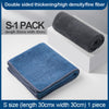 A stack of dark blue microfiber cleaning towels is shown next to a box, with text indicating S-1 pack details.