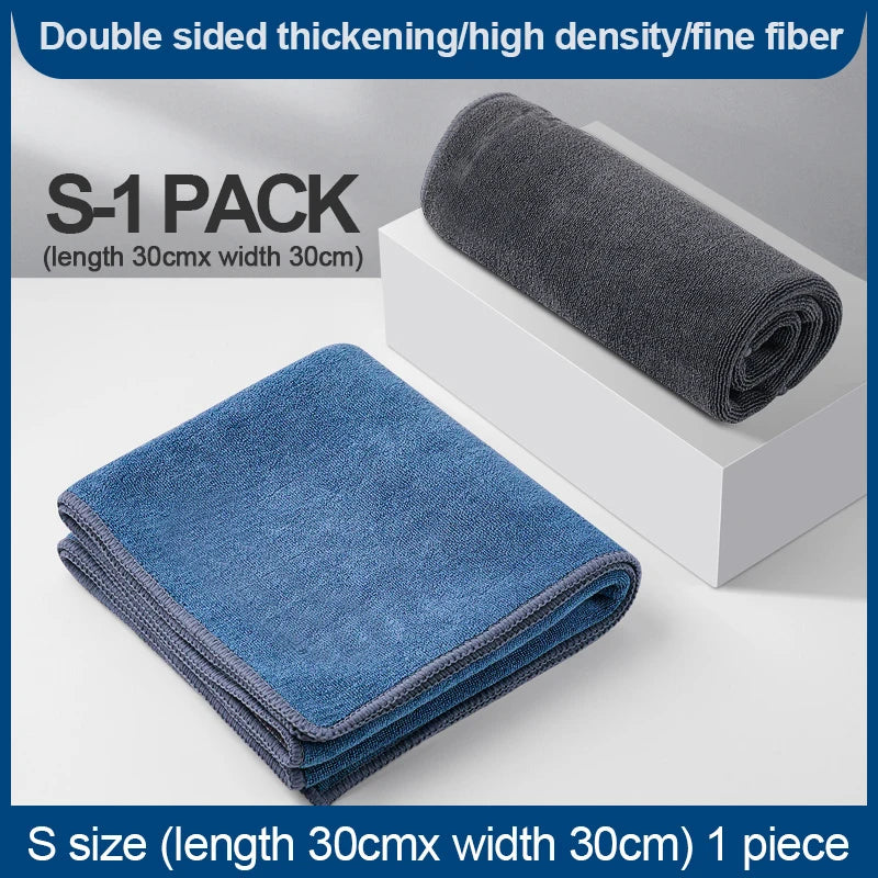 A stack of dark blue microfiber cleaning towels is shown next to a box, with text indicating S-1 pack details.
