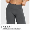 A close-up shot of a model wearing dark gray high-waisted yoga pants.