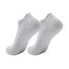 A pair of white women's yoga and fitness socks shown from above.