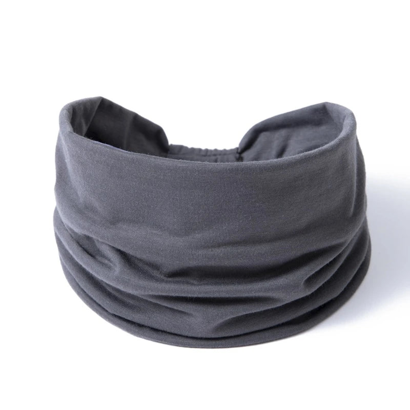 A gray boho wide headband hair wrap for women shown flat.