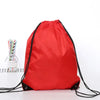 A bright red multipurpose drawstring storage bag with black drawstrings is shown against a white background.