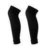 A pair of black compression football socks for athletes.