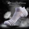 White athletic ankle socks shown in a close-up, emphasizing the knit texture and performance technology.