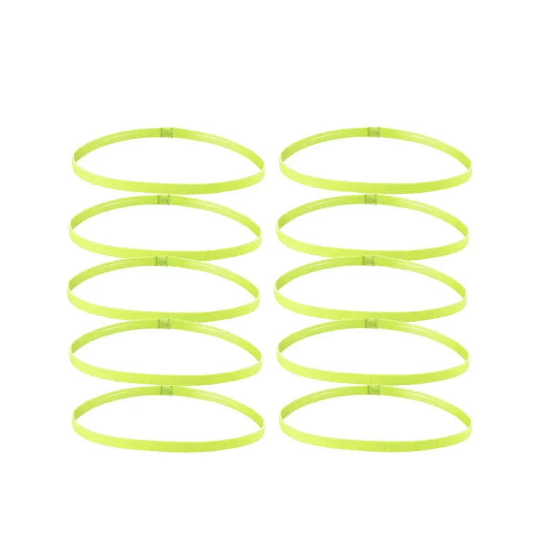 A set of five bright lime green elastic sports headbands laid out horizontally.