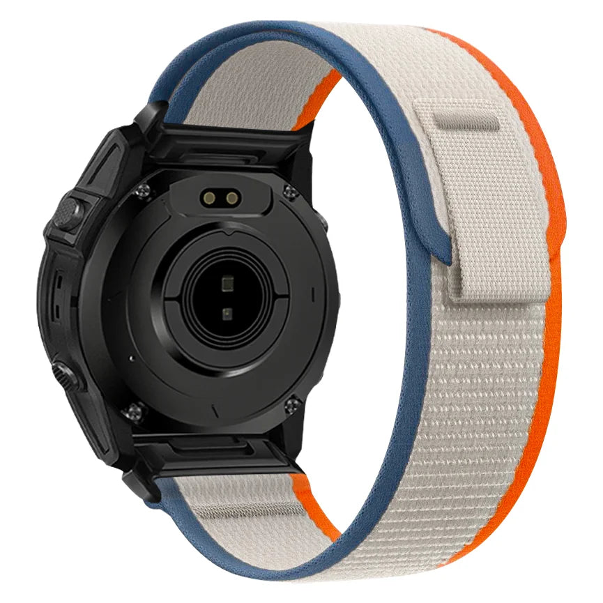 A black sports watch with a light gray and orange nylon strap is shown from the side.