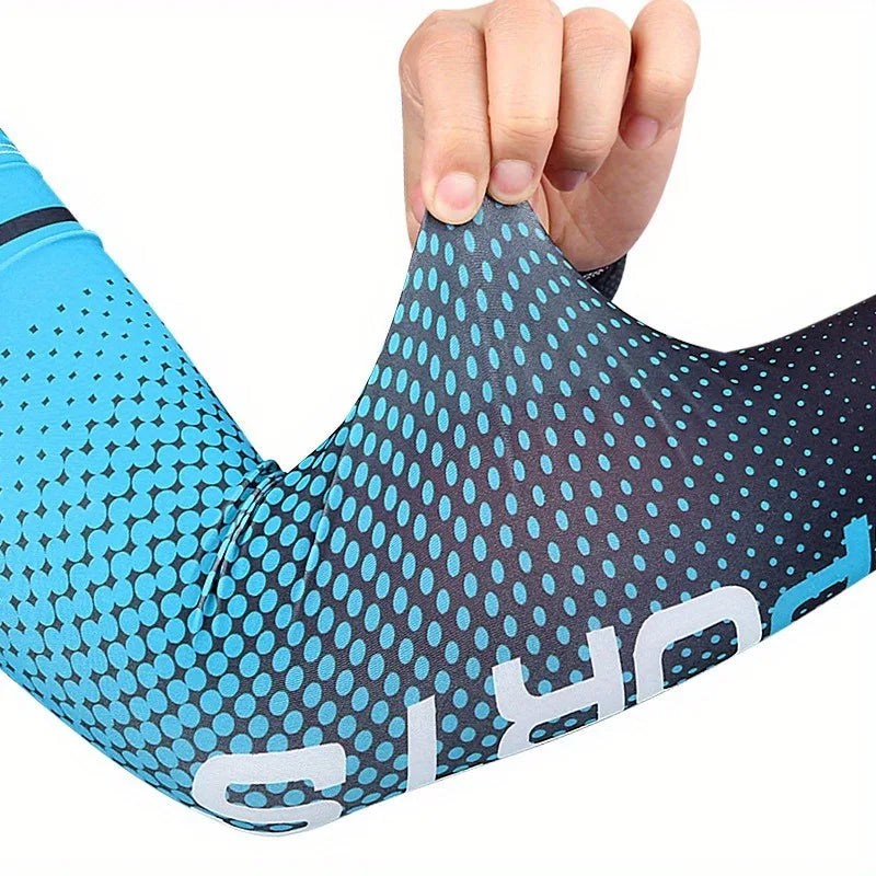 A hand is pulling on a blue and black UV protection arm cooling sleeve for outdoor activities.