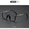 A pair of retro black anti-blue light glasses with gold accents shown from the side.