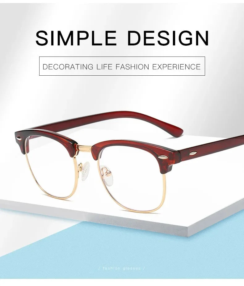 A pair of brown-framed, round eyeglasses with gold accents resting on a white surface.