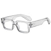 Clear plastic square-framed eyeglasses with a silver rivet detail