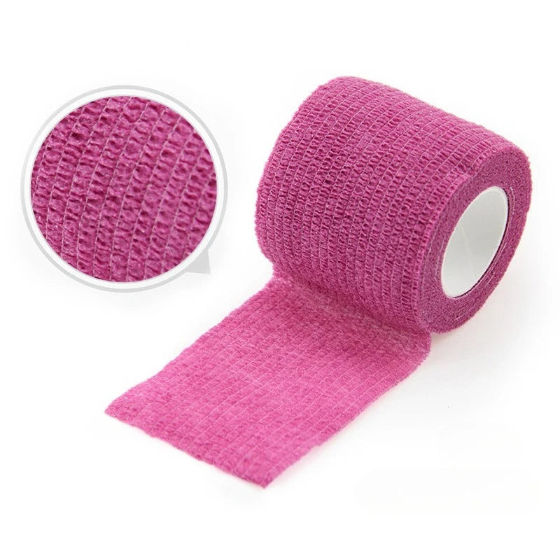 Roll of pink self-adhesive elastic bandage tape with a circular view of the textured material
