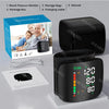 A black digital wrist blood pressure monitor device shown with its box, accessories, and manual.