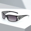Gafas negras con montura cuadrada y estampado floral blanco