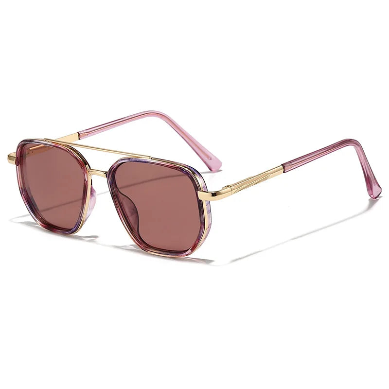 A pair of rose gold-framed sunglasses with tinted lenses resting on a white background.