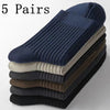 Five pairs of men's mid-tube sweat absorption socks stacked in various shades of blue, gray, and brown.