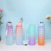 A set of five colorful leakproof sports water bottles with straws arranged on a white surface against a light blue background