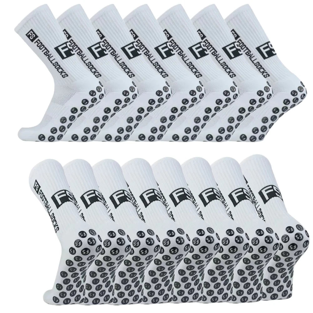 A pack of white non-slip grip socks with black text and a football design, laid out in a row.