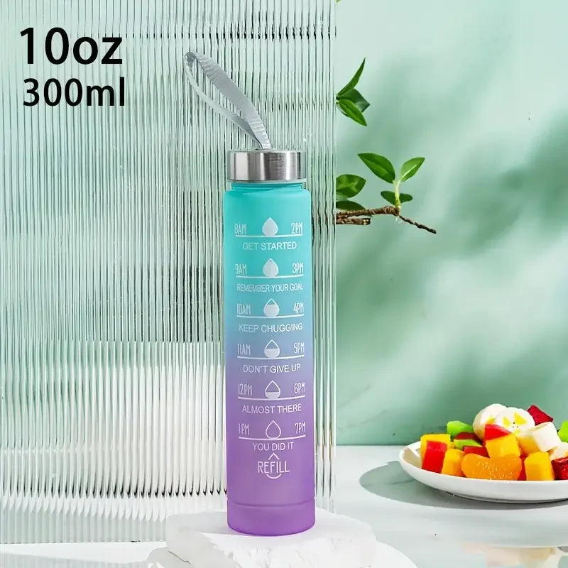 A purple sports water bottle with a silver straw and motivational text is shown against a light green background.