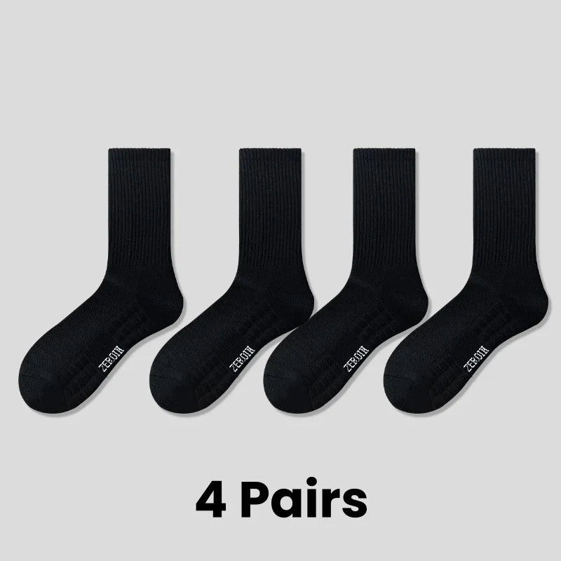 Four pairs of black breathable sports performance socks displayed individually.