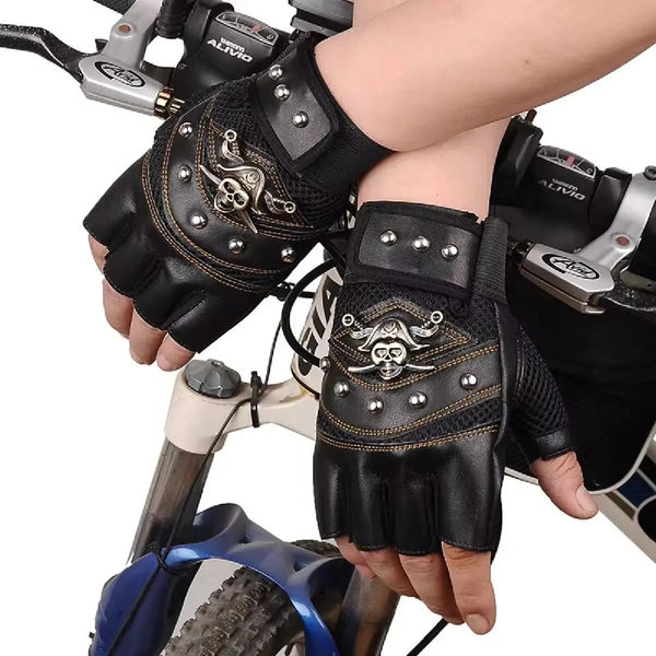 Black PU leather fingerless gloves with metal accents worn on a hand next to a bicycle.