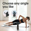 A woman performs a yoga pose on a mat with an insulated stainless steel water bottle in front of her.