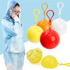 A person wearing a blue disposable rain poncho is shown next to various colored floating toys.