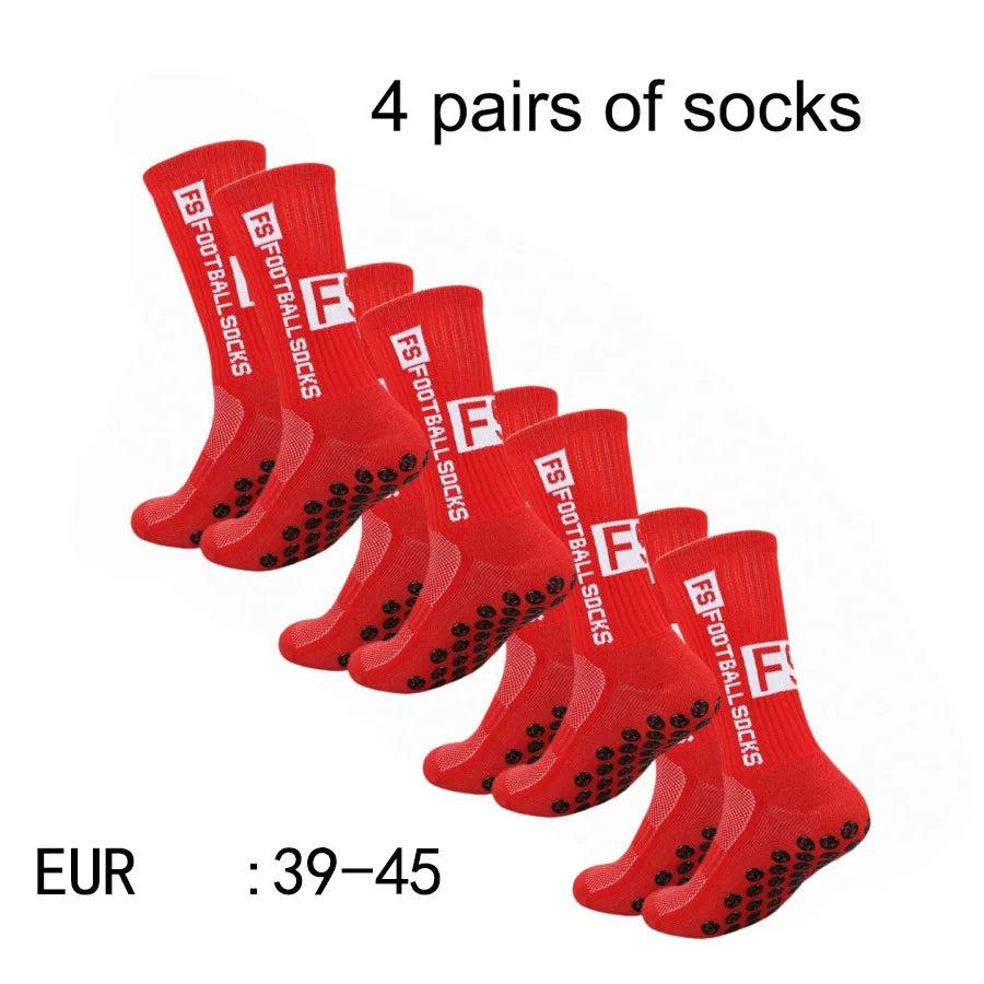 Four pairs of red athletic soccer socks with non-slip grips.