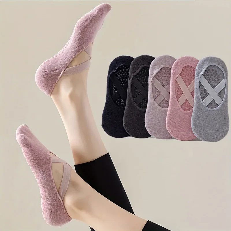 A pair of non-slip yoga and gym socks in various pastel colors with silicone grip shown on a foot.
