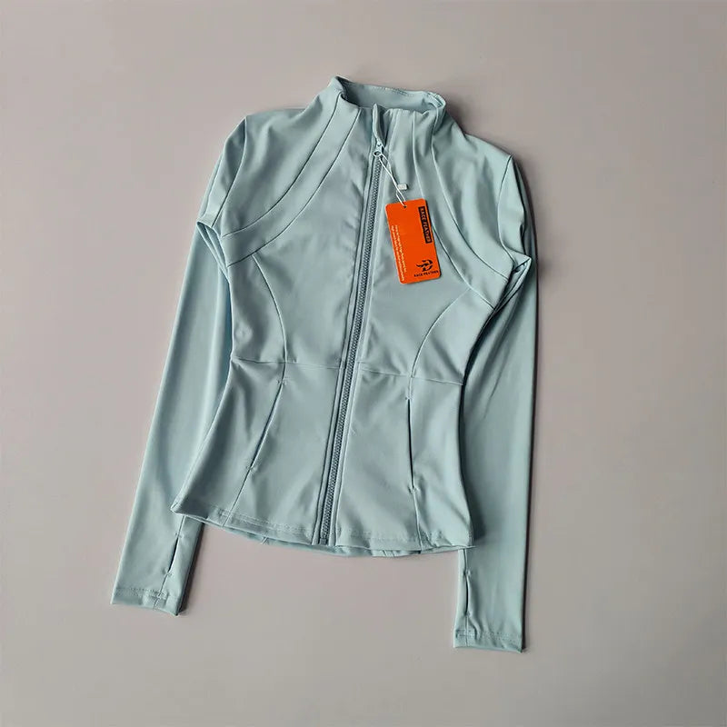 A light blue quick-dry yoga and fitness jacket with a full zip collar is displayed on a plain background.