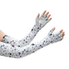 A hand wearing patterned, long-sleeved arm and hand protection sleeves.