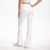 A person wearing white high-waisted flared yoga leggings and a white cropped top.