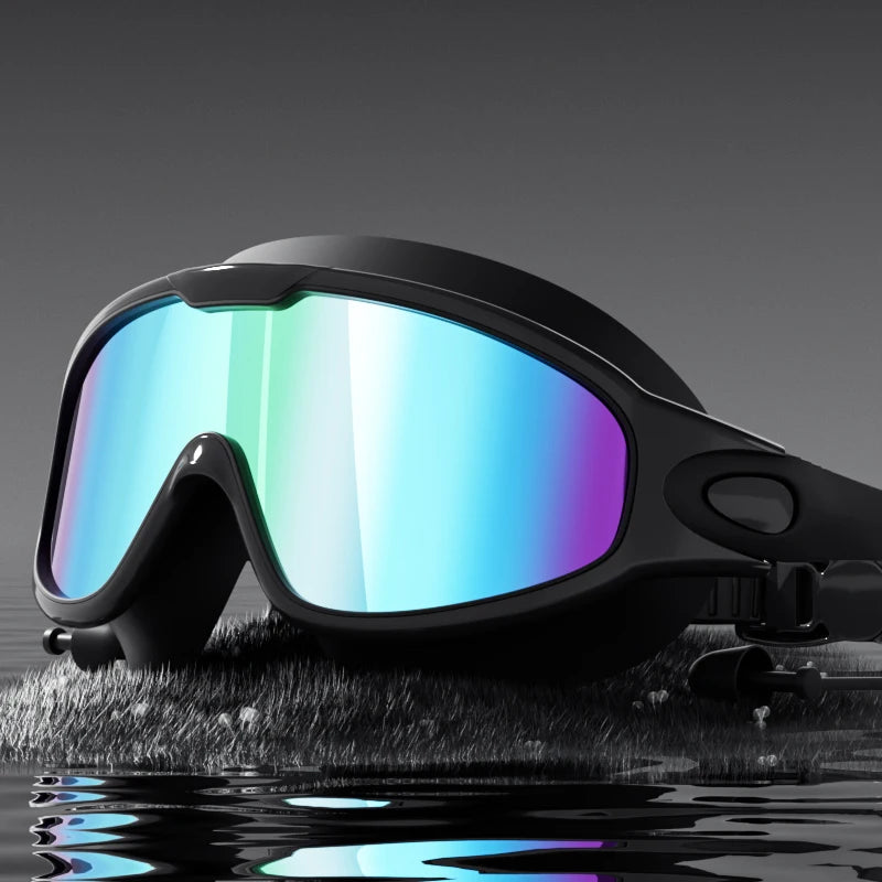 A pair of black swimming goggles with iridescent blue and purple lenses resting on a wet, dark surface.