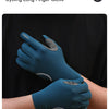 A close-up of a teal cycling long finger glove being worn on a hand against a dark background.