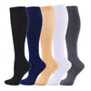A row of nine medical grade compression socks in various colors including black, navy blue, beige, white, and gray.