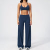 A woman wearing a navy blue women's premium fitness tracksuit top and matching pants.