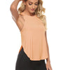 A woman wearing a peach-colored quick-dry yoga and gym tank top and black leggings.