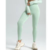 A model wearing light mint green seamless high-waist yoga leggings and a matching cropped top.