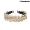 A beige braided hair accessory made of cream blonde hair.