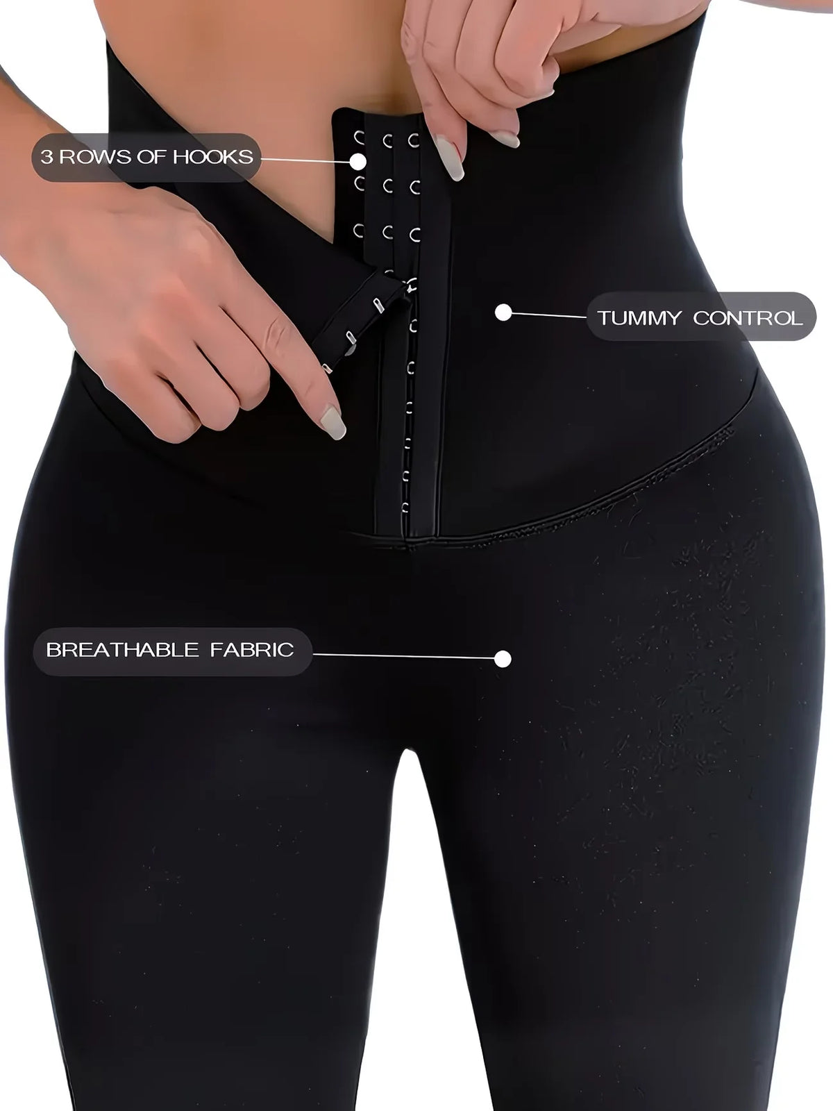 Close-up of a black high waisted shaping legging showing hook closures and breathable fabric features.
