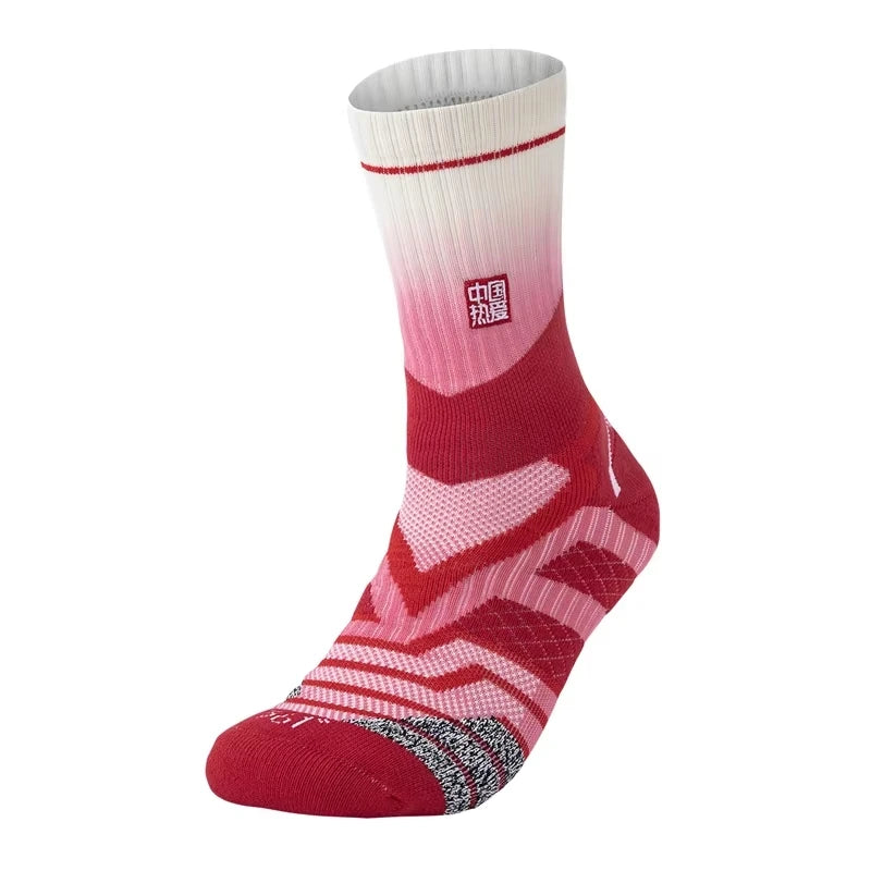 A close-up view of a pair of red and white performance basketball running socks.