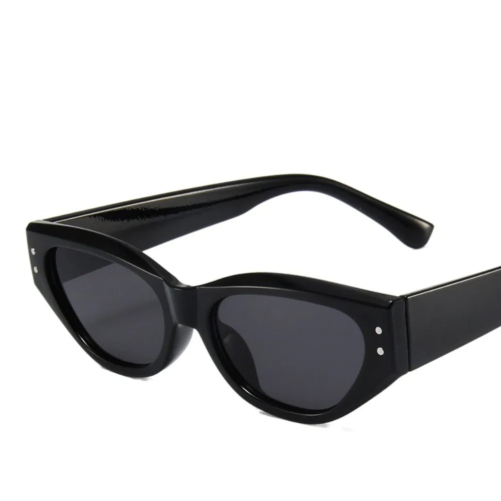 Black Y2K cat eye rhinestone sunglasses with a black frame and dark lenses