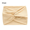 A beige khaki fabric headband is shown folded into a cross-knotted design.