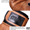 Close-up of a brown leather boxing glove showing hand-cut seams and a black wrist buckle.