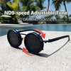 ND9-speed adjustable tone ND dimming glasses resting on a concrete surface near a swimming pool.