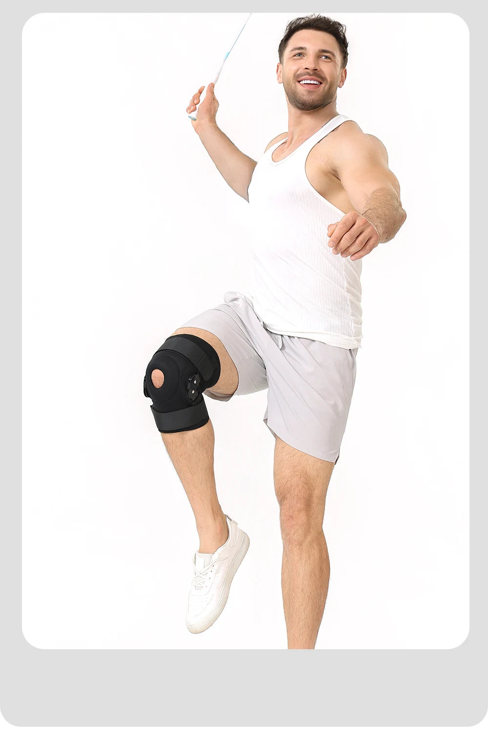 A muscular man demonstrates an adjustable knee pad with dual stabilizers for joint support.