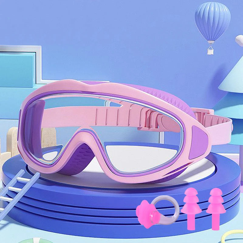 Pink swimming goggles for children resting on a blue circular platform with a purple ladder and a light blue balloon in the b