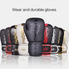 A collection of black and white boxing gloves displayed on a light background.